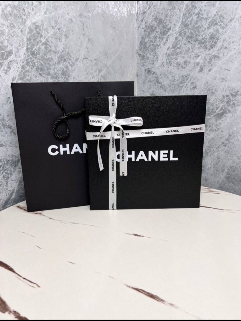 Black Box with White Branded Ribbon